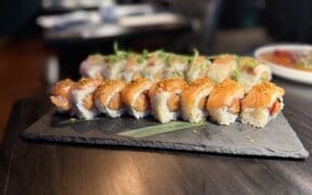 The Akira roll at Across the Pond combines spicy salmon, tamarind sauce and a garlic crumble.