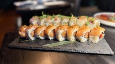 The Akira roll at Across the Pond combines spicy salmon, tamarind sauce and a garlic crumble.