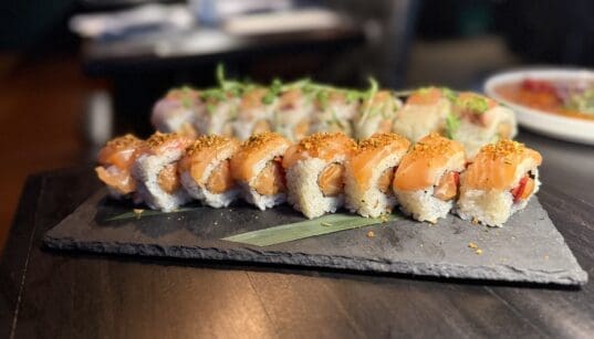 The Akira roll at Across the Pond combines spicy salmon, tamarind sauce and a garlic crumble.