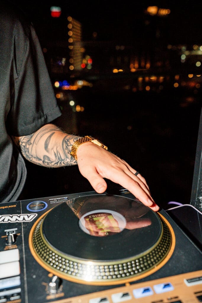 DJ performing during rooftop nightlife event at Tenfold Rooftop in San Antonio.