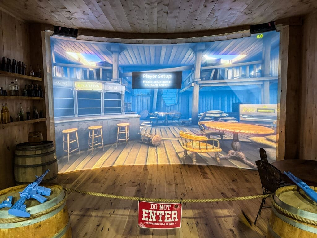An immersive Wild West-themed gaming room inside the Gold Rush Saloon attraction at Immersive Empire.