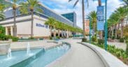 Exterior view of Hilton Anaheim with palm trees, fountain and resort entrance near Disneyland Resort in Anaheim, California.