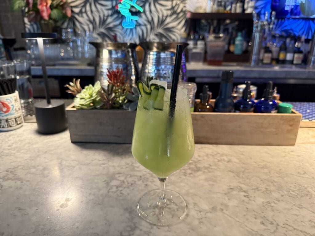 Green mocktail at the bar inside Across the Pond sushi restaurant in Midtown Phoenix.