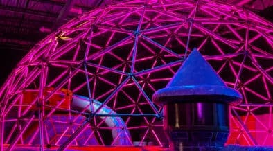 A glowing neon dome installation inside Immersive Empire in Lafayette, Colorado.
