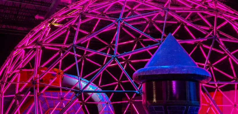 A glowing neon dome installation inside Immersive Empire in Lafayette, Colorado.