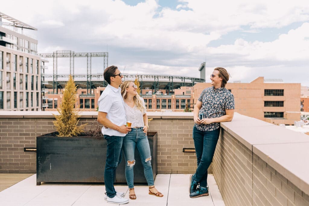 Guests enjoying rooftop views near Coors Field at The Maven Hotel in Denver, Colorado.