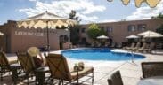Pool area and lounge chairs at Hotel Glorieta in Santa Fe, New Mexico on a sunny afternoon.