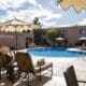 Pool area and lounge chairs at Hotel Glorieta in Santa Fe, New Mexico on a sunny afternoon.