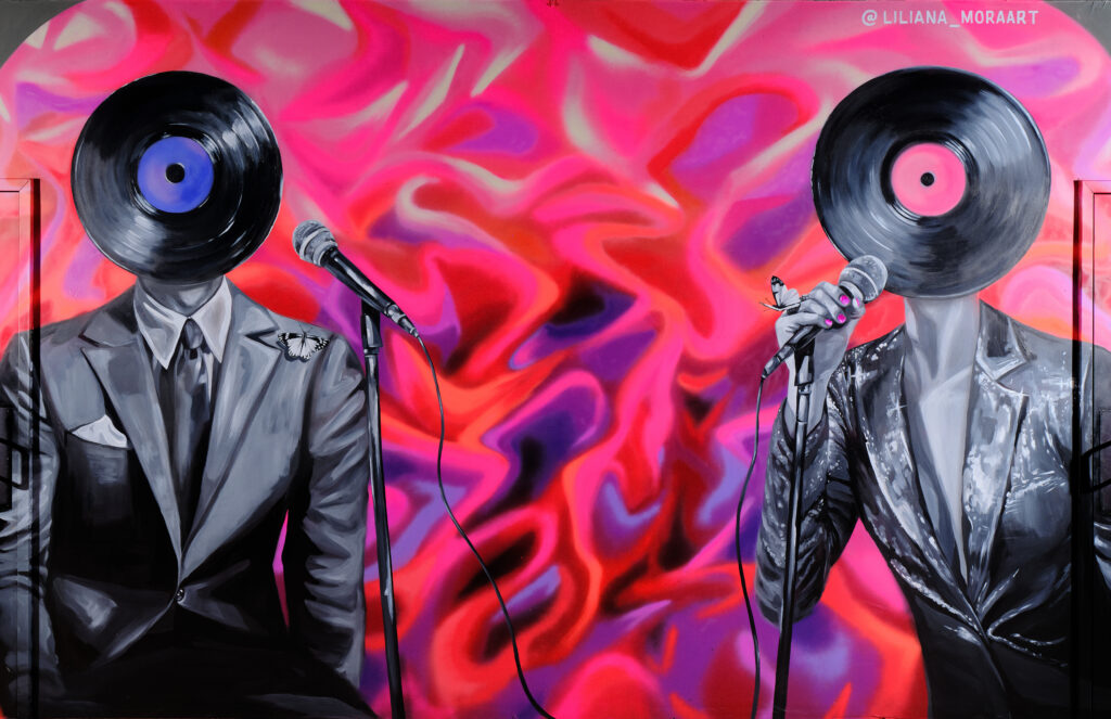 Colorful mural featuring vinyl record-headed singers inside Off The Record in Downtown Phoenix.