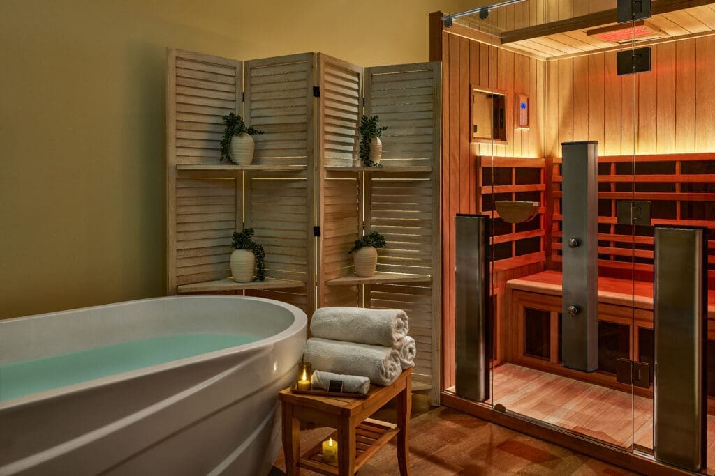 Luxury spa recovery room with infrared sauna and soaking tub at The Highland Dallas in Dallas, Texas.