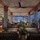 Tenfold Rooftop lounge overlooking downtown San Antonio at night.