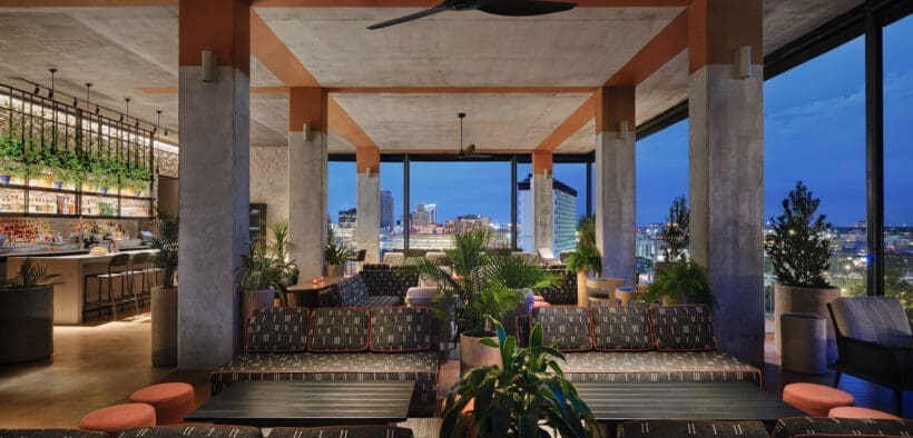 Tenfold Rooftop lounge overlooking downtown San Antonio at night.
