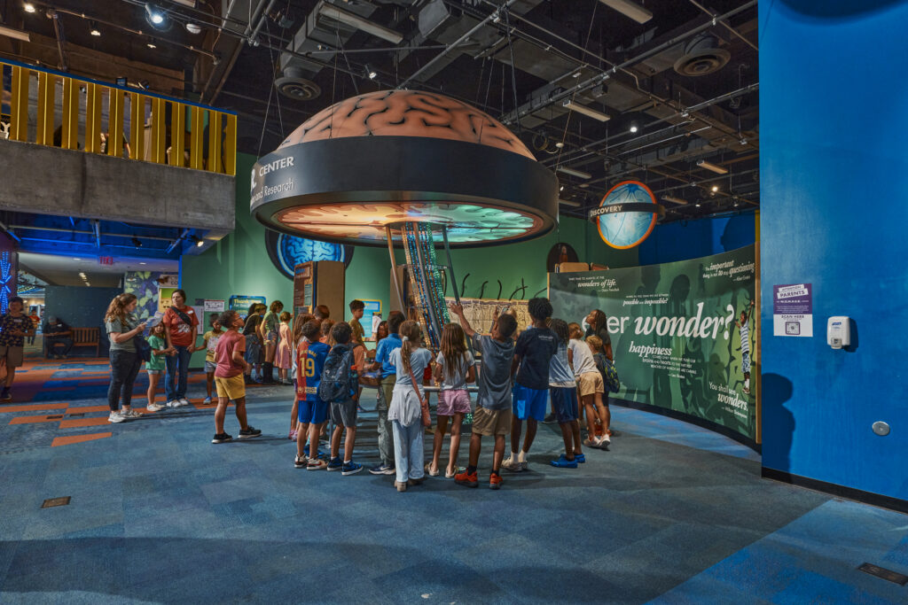 Families explore interactive exhibits inside Arizona Science Center in downtown Phoenix.