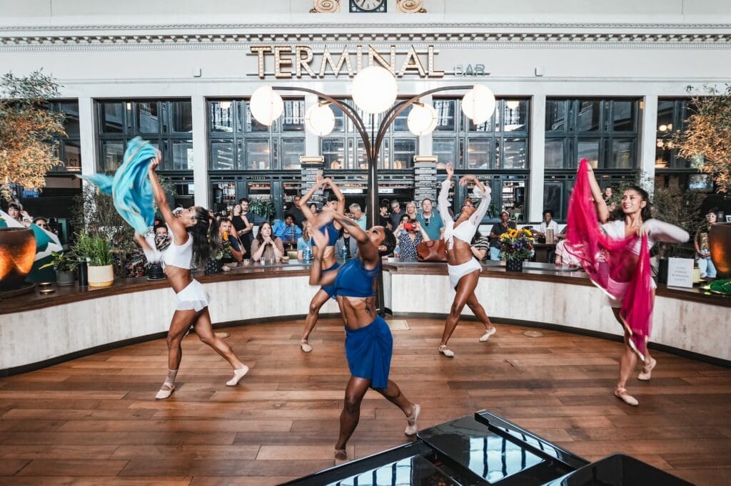 Dancers perform inside Denver Union Station during a Colorado Day celebration.