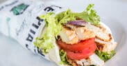 Roasted Shawarma Pita from Pita Jungle filled with grilled chicken, tomatoes, lettuce and Mediterranean-inspired ingredients.