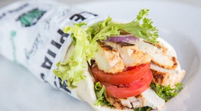 Roasted Shawarma Pita from Pita Jungle filled with grilled chicken, tomatoes, lettuce and Mediterranean-inspired ingredients.