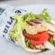 Roasted Shawarma Pita from Pita Jungle filled with grilled chicken, tomatoes, lettuce and Mediterranean-inspired ingredients.