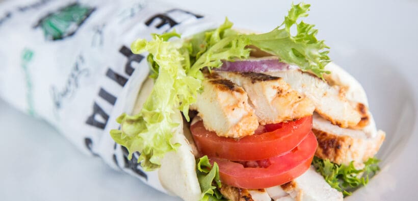 Roasted Shawarma Pita from Pita Jungle filled with grilled chicken, tomatoes, lettuce and Mediterranean-inspired ingredients.
