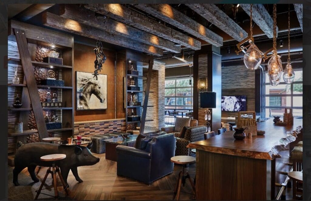 The interior of Dust Cutter restaurant at Renaissance Phoenix Downtown Hotel features warm wood accents, lounge seating and a modern Arizona-inspired design.