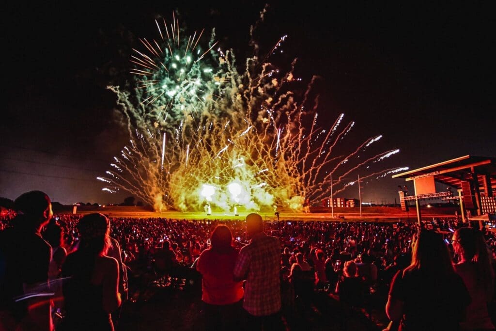 Fireworks explode over spectators during Fort Worth's Fourth at Panther Island Pavilion in Fort Worth, Texas.