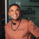 Chef Marc Quiñones smiles while standing inside La Fonda on the Plaza in Santa Fe, New Mexico.