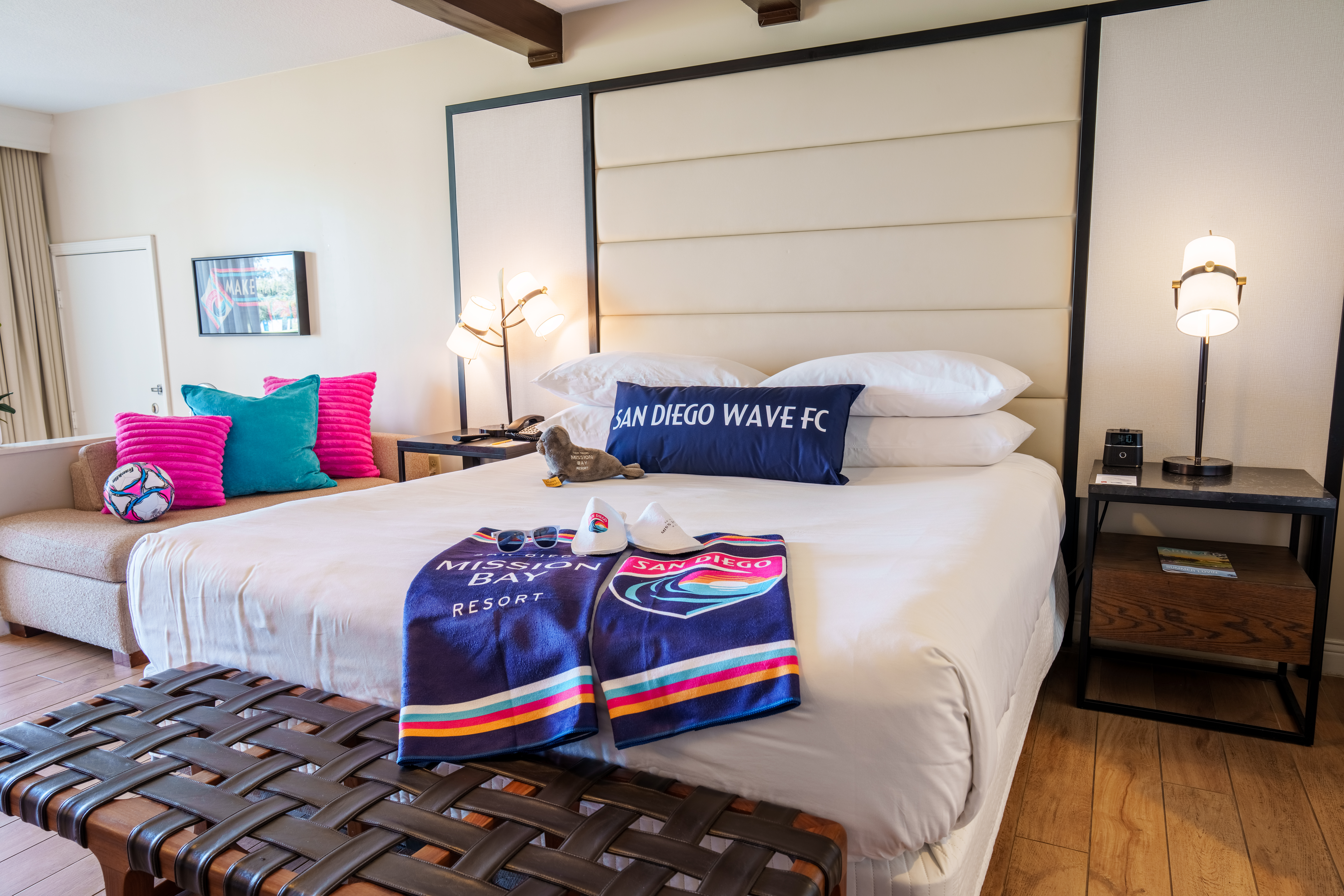King bedroom inside the San Diego Wave FC Suite at San Diego Mission Bay Resort featuring team-branded décor and memorabilia.