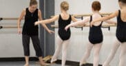 Ballet instructor teaching young dancers during class at The School of Ballet Arizona's North Central Phoenix campus.