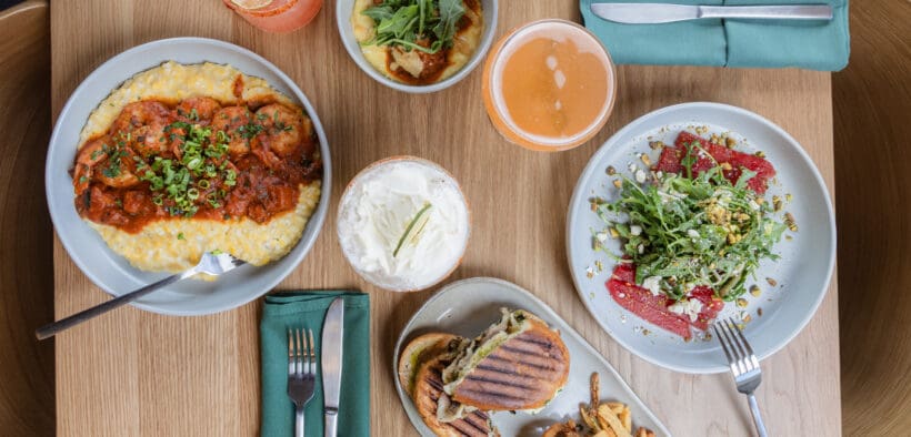 Seasonal dishes, cocktails and handcrafted beverages on a table at CAYA restaurant in Edwards, Colorado.