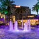 Harrah's Southern California Resort exterior at dusk with illuminated fountains and palm trees in Funner, California.