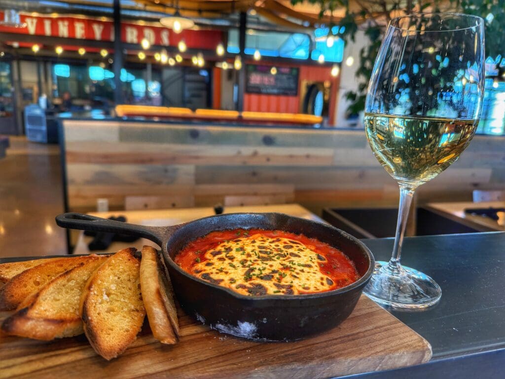 A bowl of pasta with toasted crustini and white wine at Merkin Vineyards in Cottonwood, Ariz.