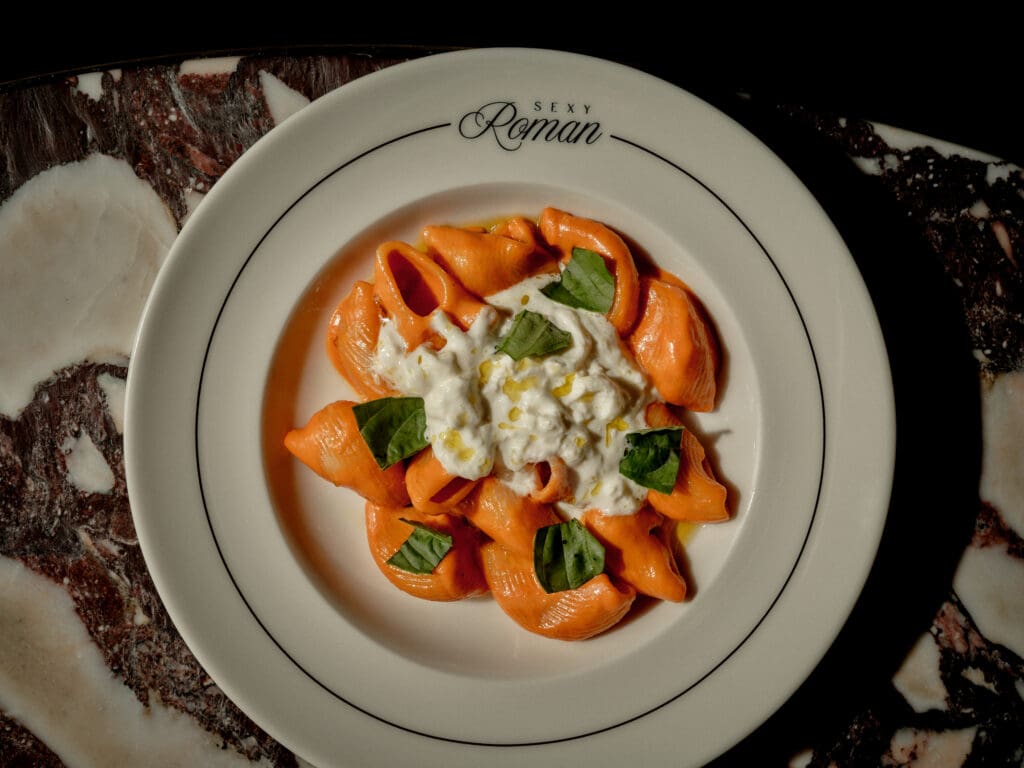 A bowl of pasta with sauce and basil on top at the Sexy Roman in Scottsdale, Ariz.