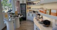 Boutique retail area inside Sway Wellness Spa in Denver's Larimer Square featuring skincare products and wellness items.
