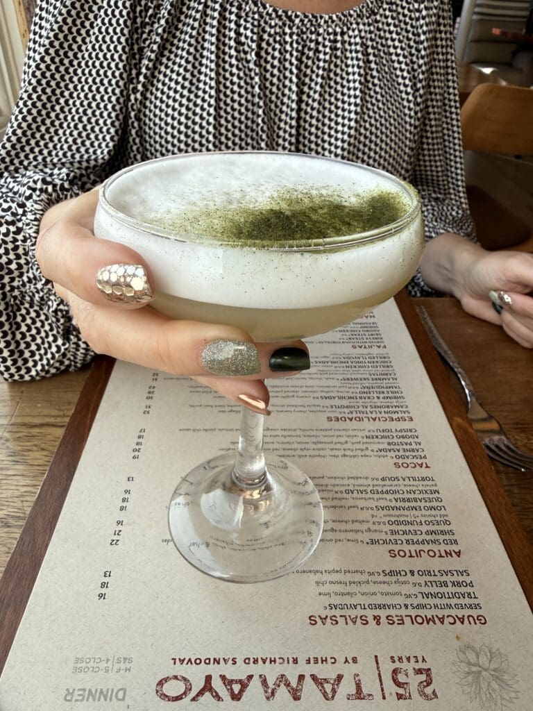 Garden Grove zero-proof cocktail with a foamy top and green garnish at Tamayo in Denver.