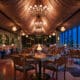 Oleander dining room with chandeliers and panoramic Los Angeles views at The Sun Rose West Hollywood.