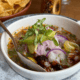 Red snapper ceviche with avocado, red onion and herbs served over ice at Tamayo in Denver.