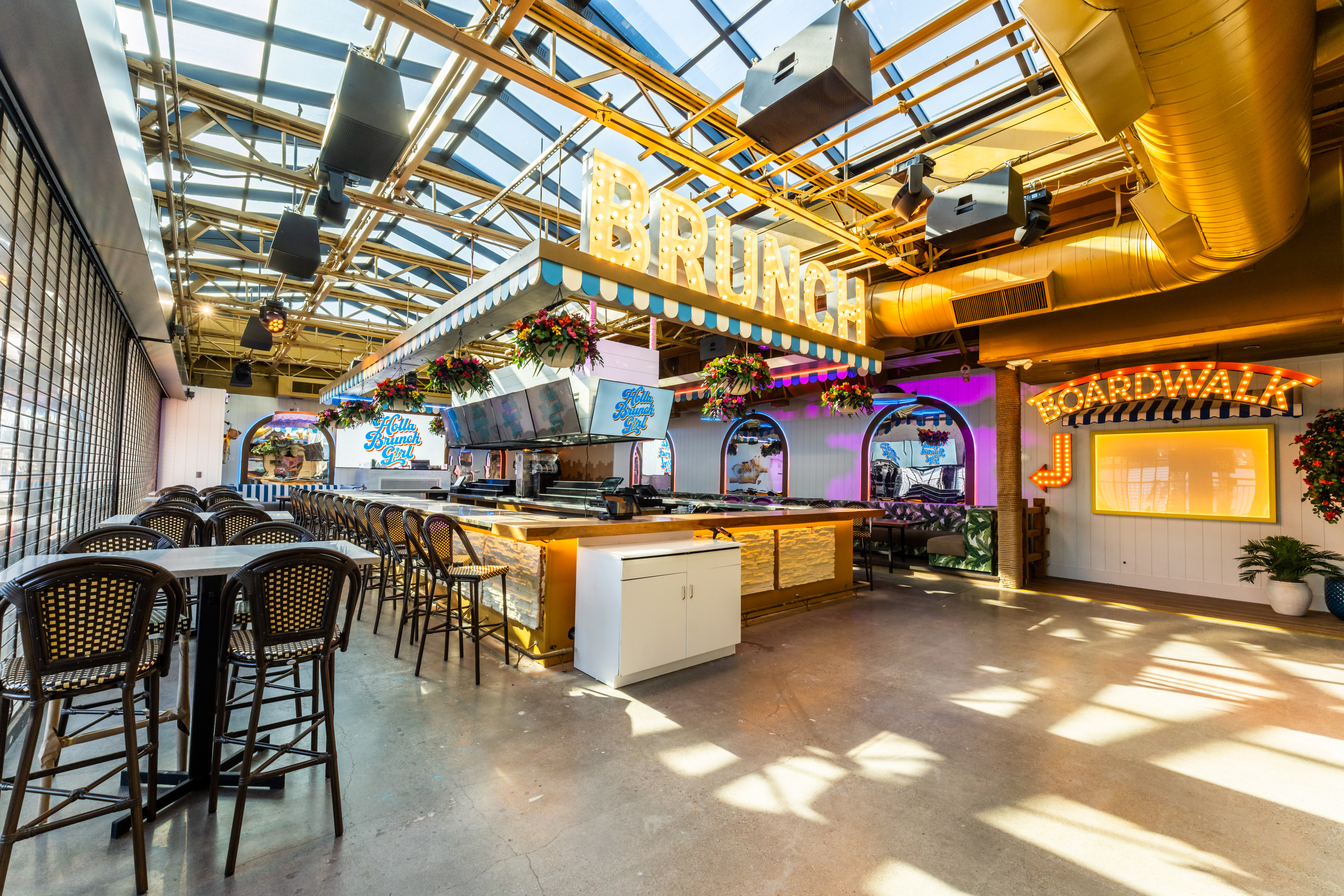 Holla Brunch Girl rooftop interior with large Brunch and Boardwalk signs in Old Town Scottsdale