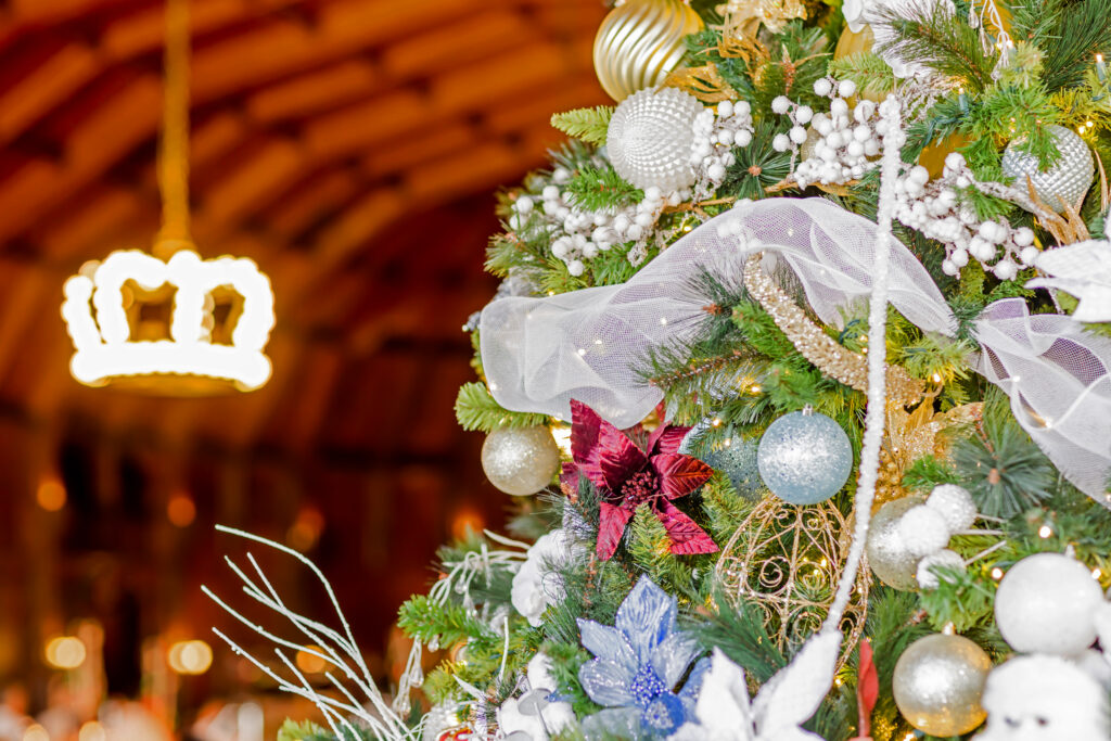 Christmas tree decorated with white, gold, blue and red ornaments inside the historic Crown Room at Hotel del Coronado.