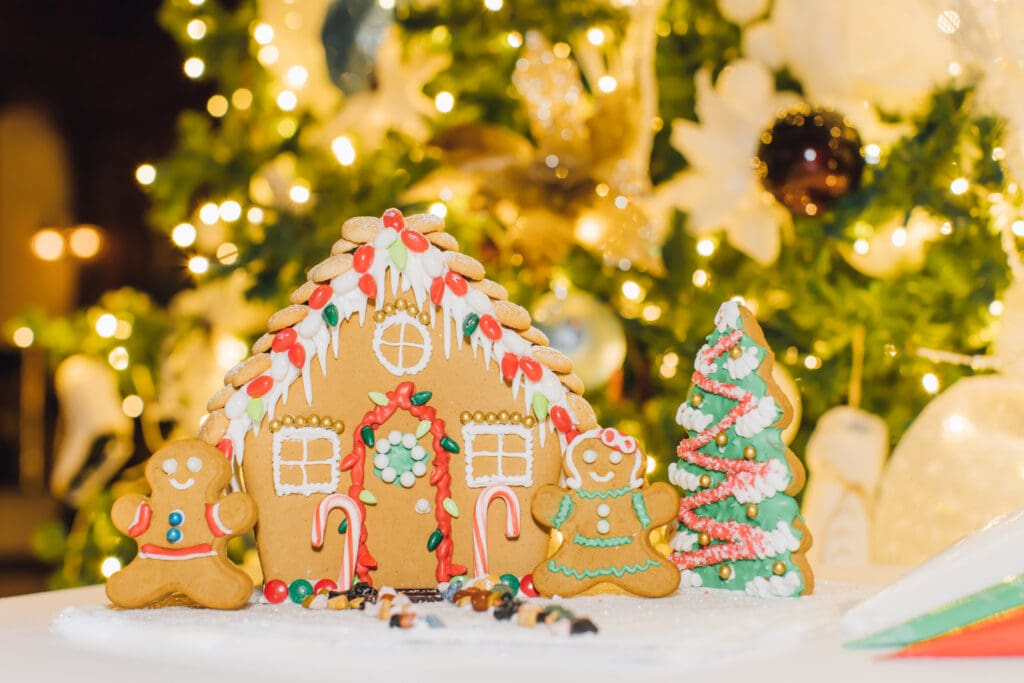 Decorated gingerbread house, gingerbread cookies and Christmas tree display at Hotel del Coronado.
