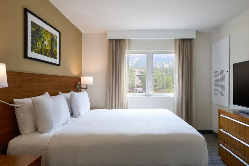 Renovated bedroom at Residence Inn by Marriott Breckenridge with a king bed and mountain views.