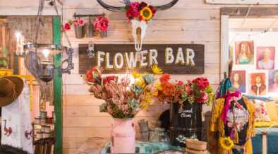 Colorful flowers, a longhorn skull and Flower Bar display inside Junk Gypsy in Round Top, Texas.
