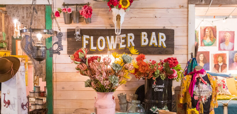 Colorful flowers, a longhorn skull and Flower Bar display inside Junk Gypsy in Round Top, Texas.