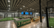 Rendering of the central bar surrounded by indoor courts at Three Rackets in Broomfield, Colorado.
