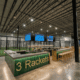 Rendering of the central bar surrounded by indoor courts at Three Rackets in Broomfield, Colorado.