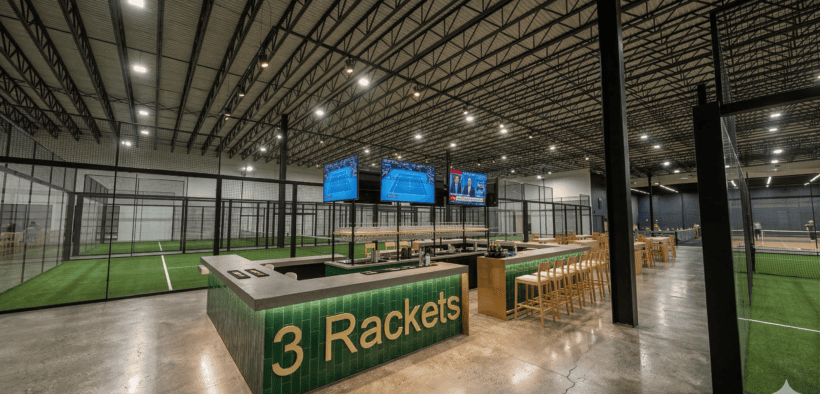 Rendering of the central bar surrounded by indoor courts at Three Rackets in Broomfield, Colorado.