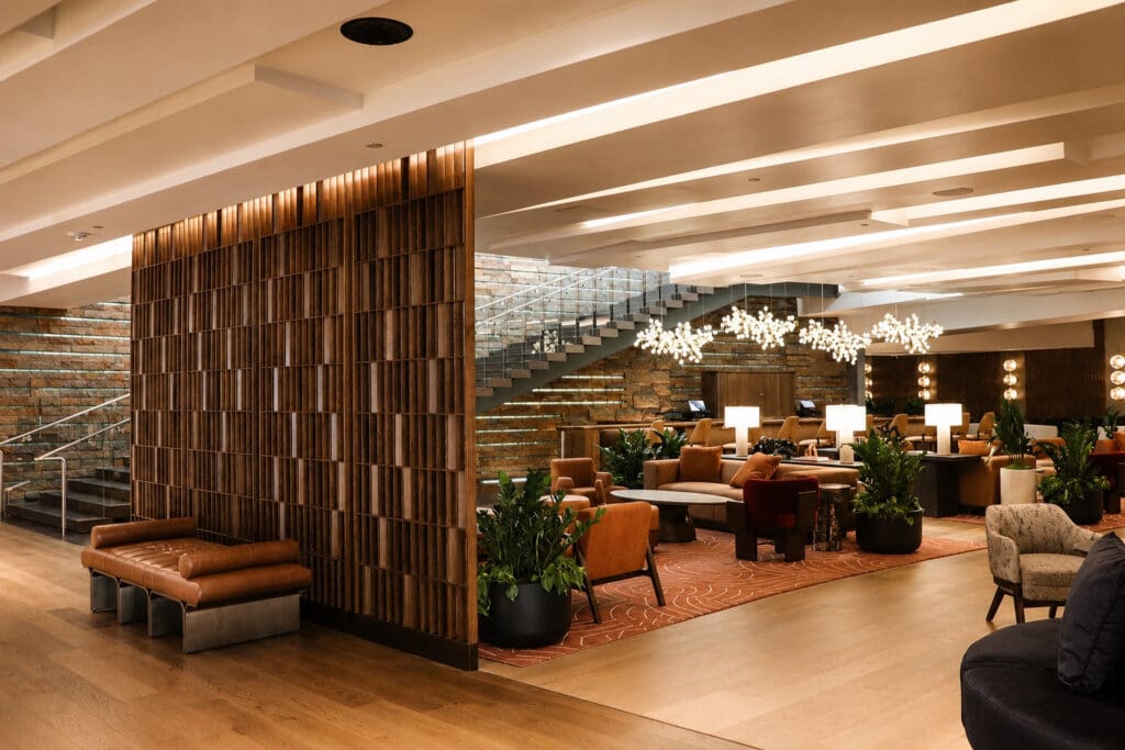 Wide view of the newly redesigned Living Room at W Scottsdale featuring desert-inspired furnishings, warm wood details and lounge seating.
