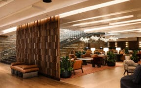 Wide view of the newly redesigned Living Room at W Scottsdale featuring desert-inspired furnishings, warm wood details and lounge seating.