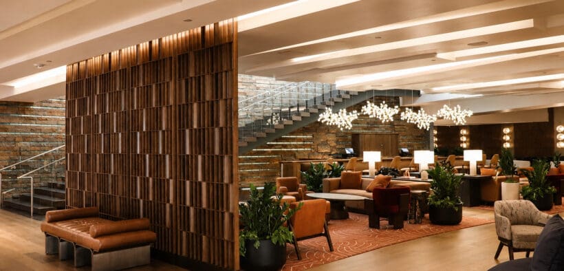 Wide view of the newly redesigned Living Room at W Scottsdale featuring desert-inspired furnishings, warm wood details and lounge seating.