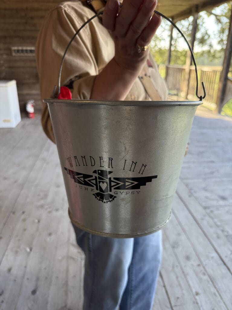 Metal Wander Inn and Junk Gypsy bucket used to deliver freshly baked biscuits to guests.