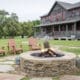 Star House at Wander Inn in Round Top with an outdoor stone fire pit and Adirondack chairs.