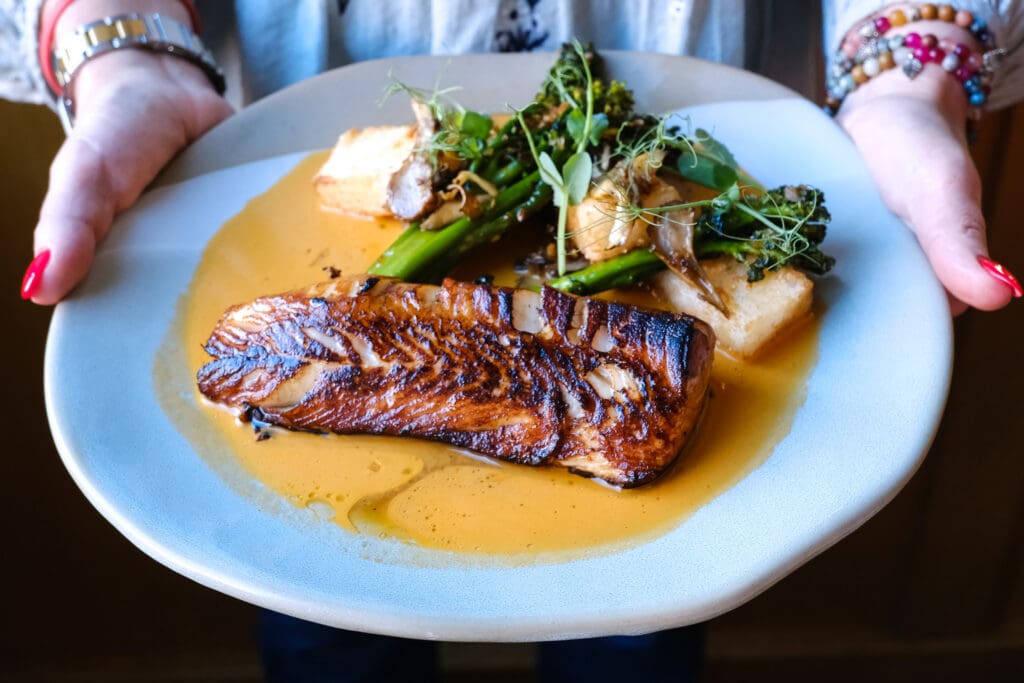 Seared black cod with broccolini and mushrooms served at Urban Farmer Denver.